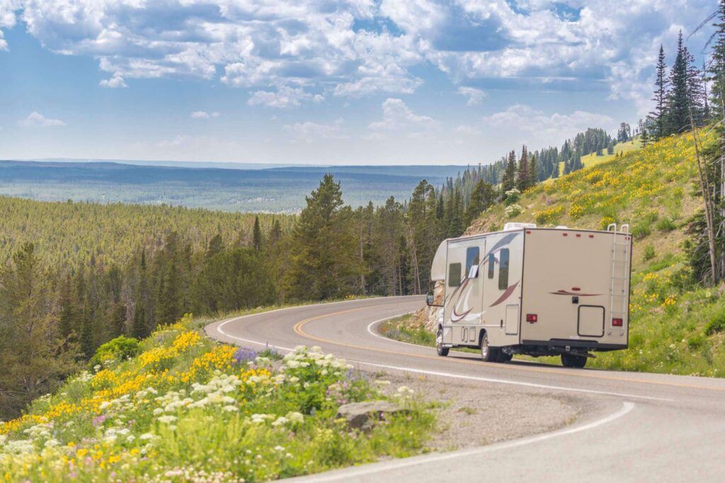 Camper Driving Down Winding Road